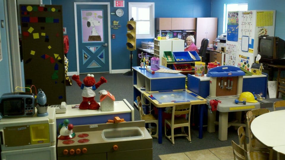 Playroom with various toys and child-sized furniture