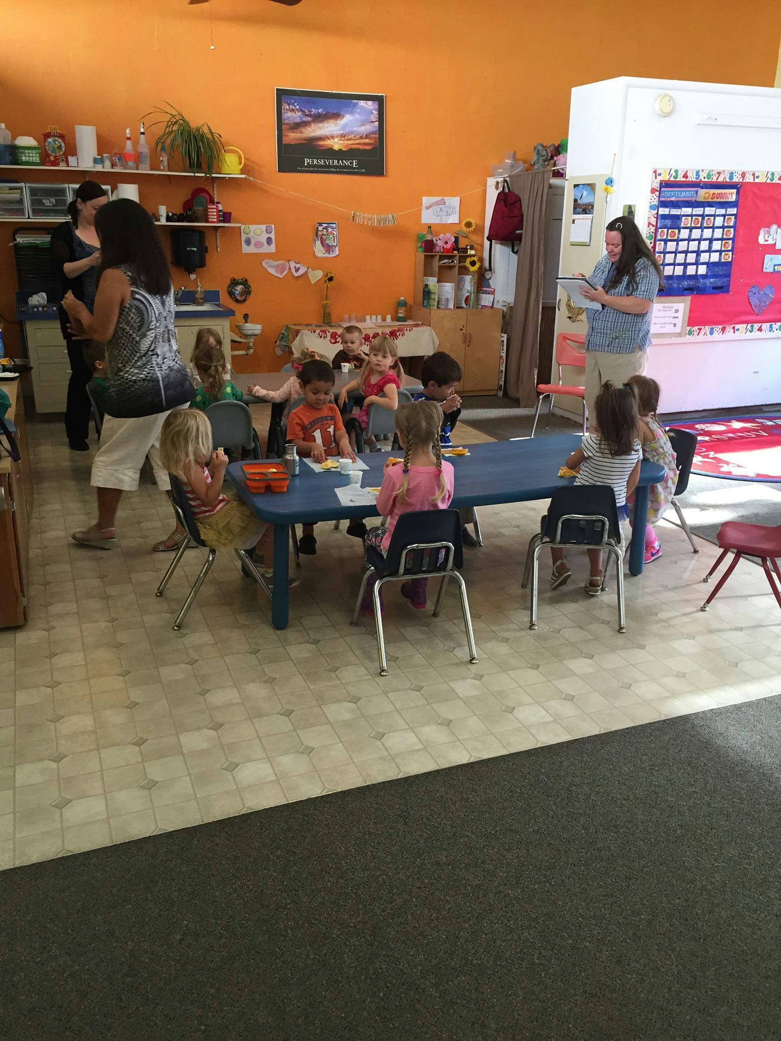 Adults and children in a classroom