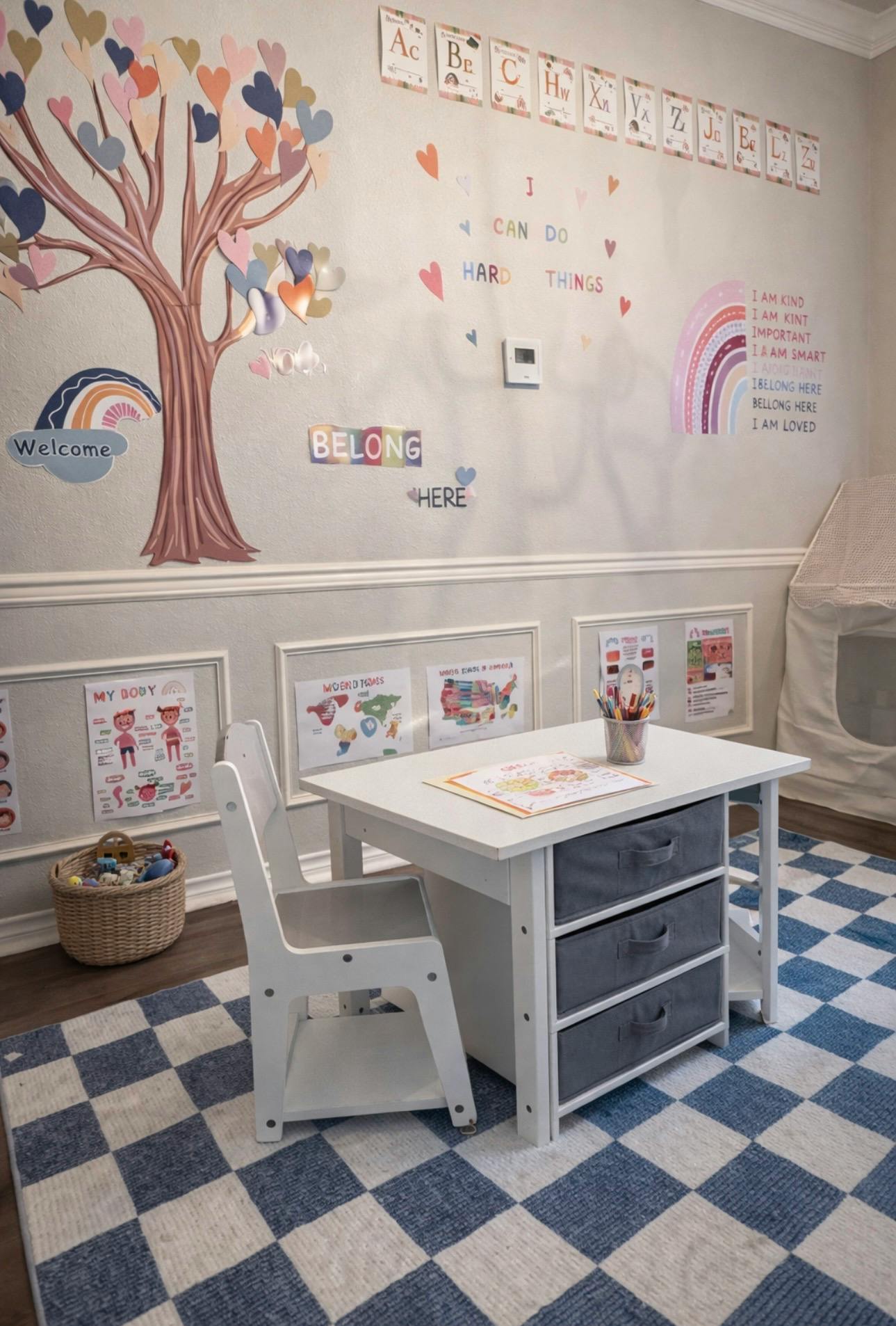 child's activity room with a small table, chair, and educational wall decor