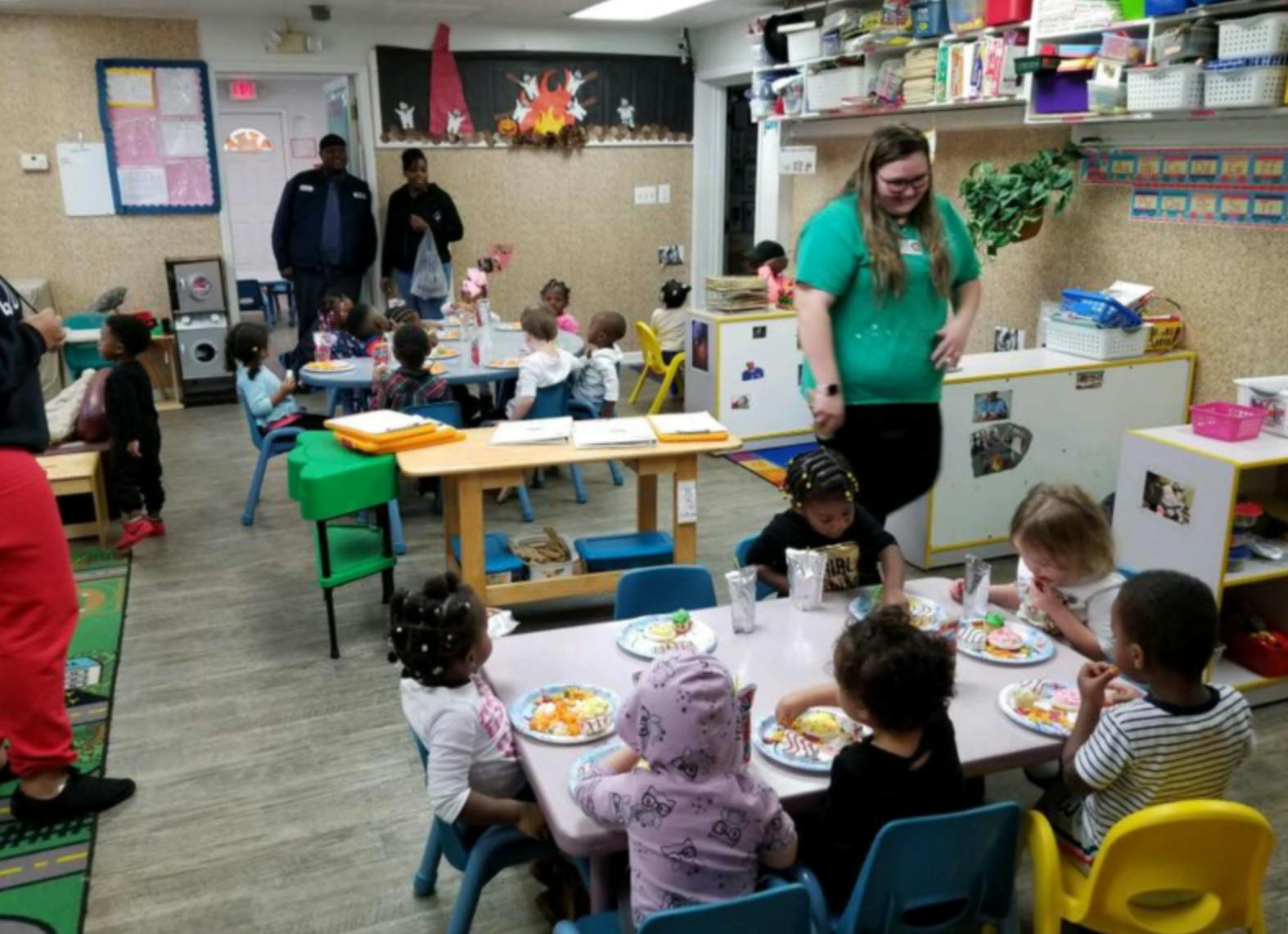 Adults and children in a classroom