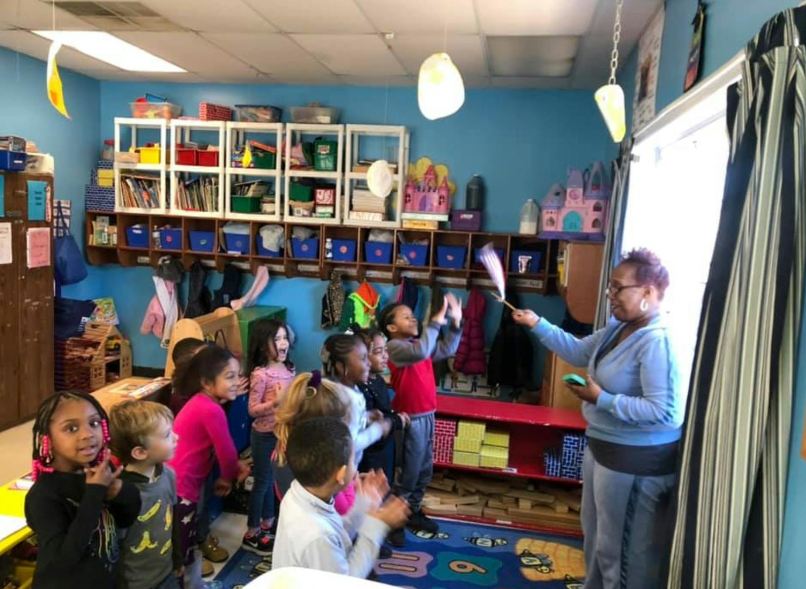 Adult and children in a classroom