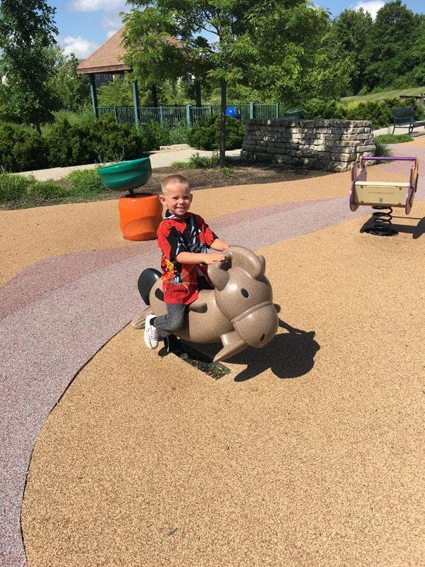 Child on a spring rider at a playground