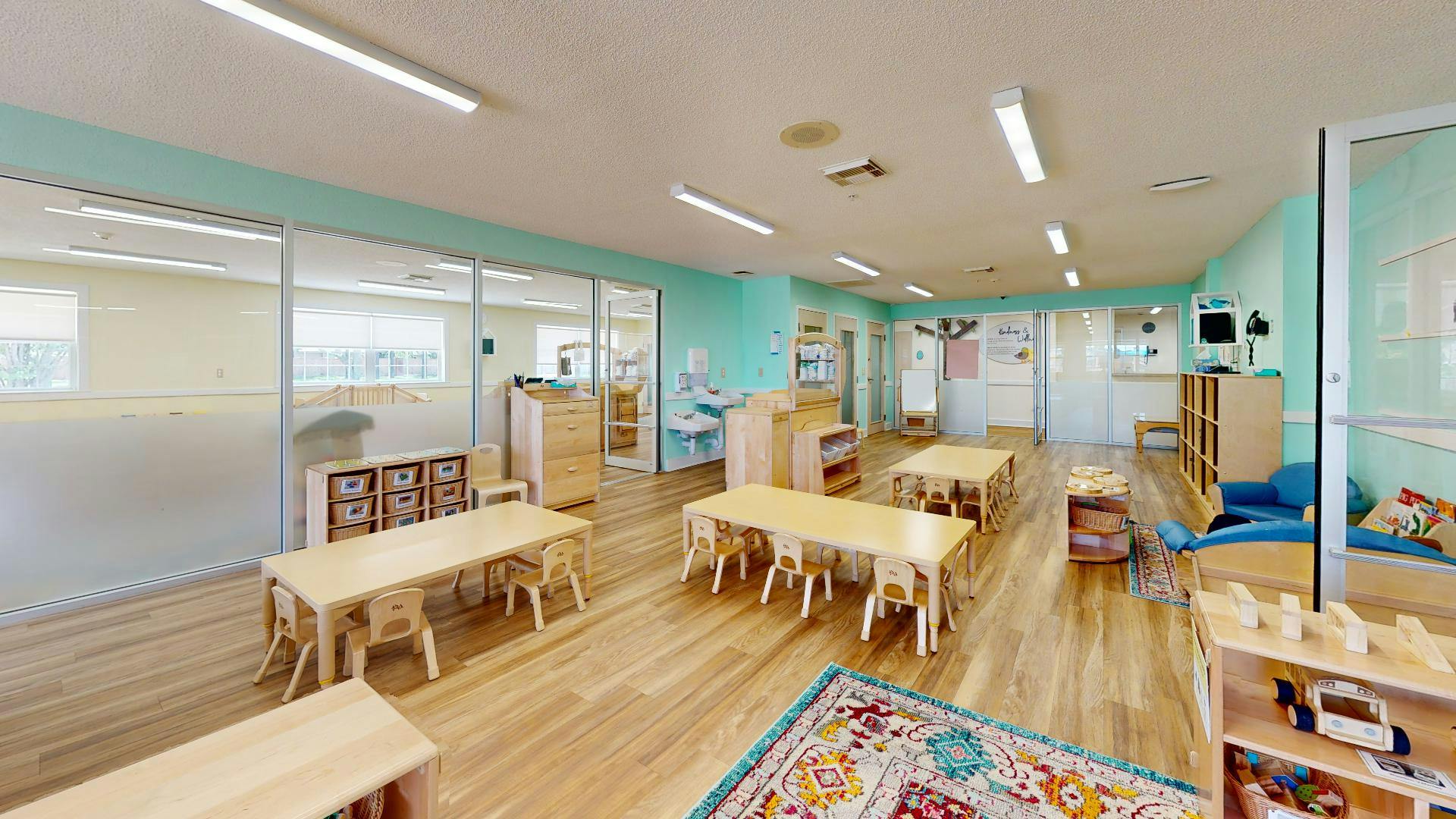 Empty classroom with small tables and chairs