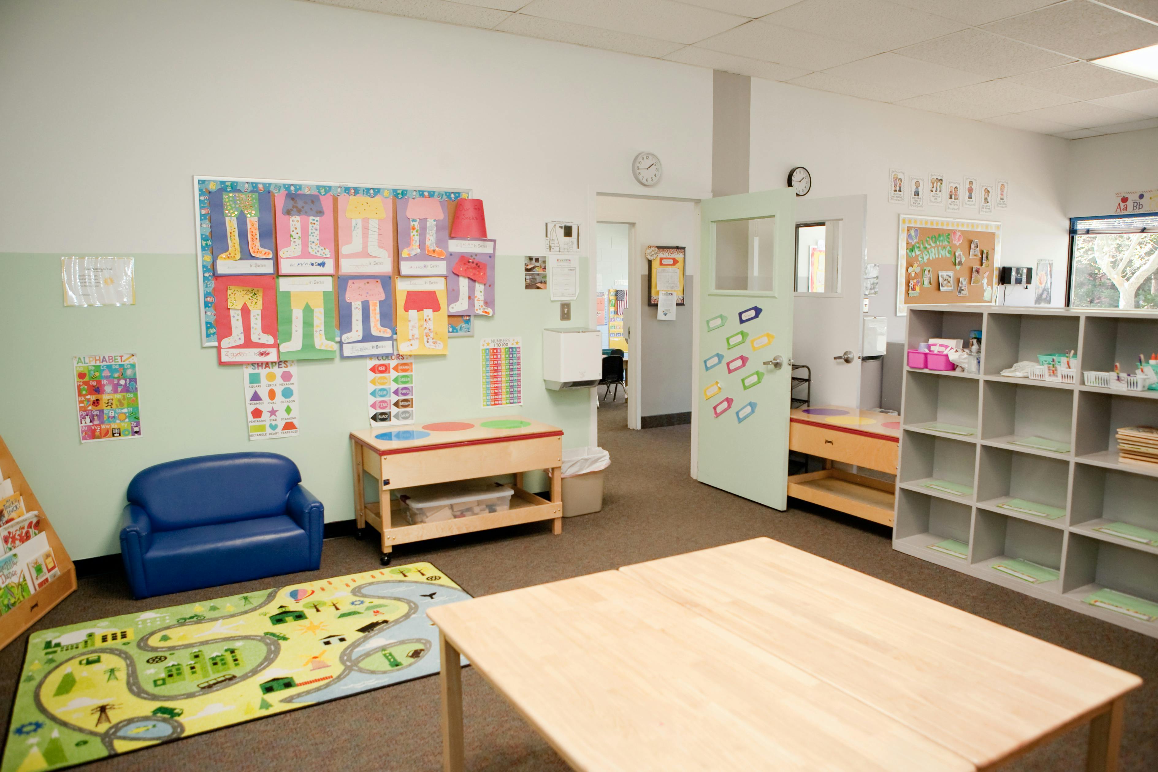 Empty classroom with small furniture and colorful decorations