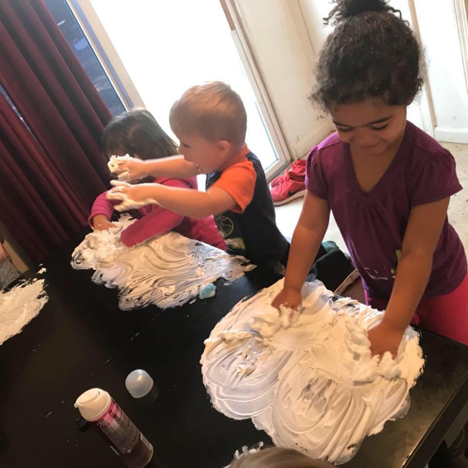 Children playing with shaving cream