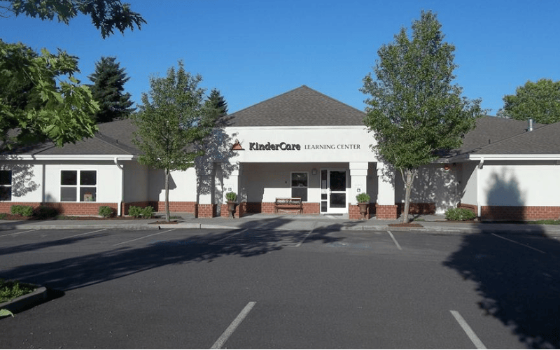 KinderCare Learning Center building with parking lot in foreground