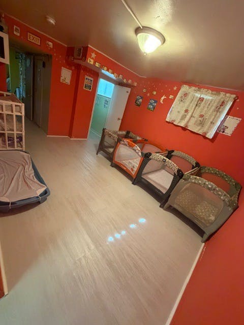 Room with red walls and several empty playards