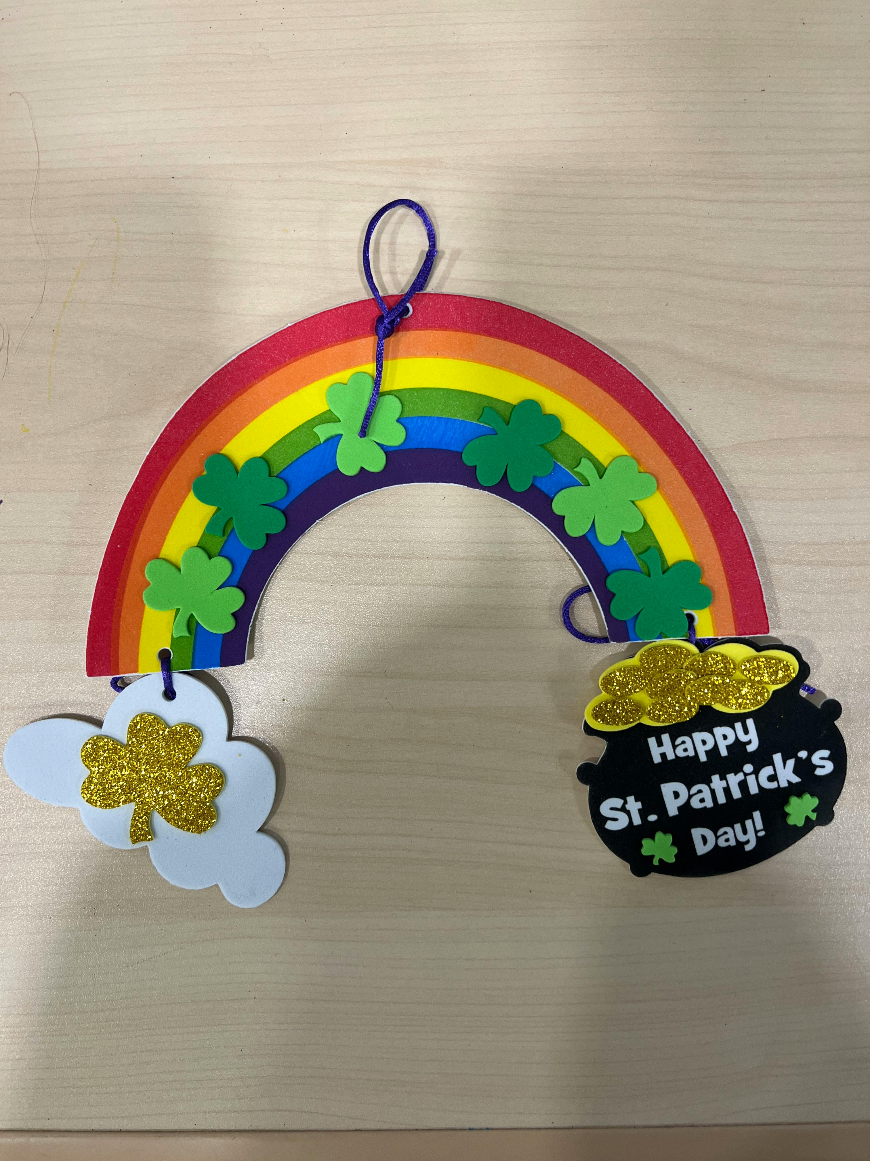 Rainbow decoration with shamrocks, a cloud, and a pot of gold with "Happy St. Patrick's Day!"