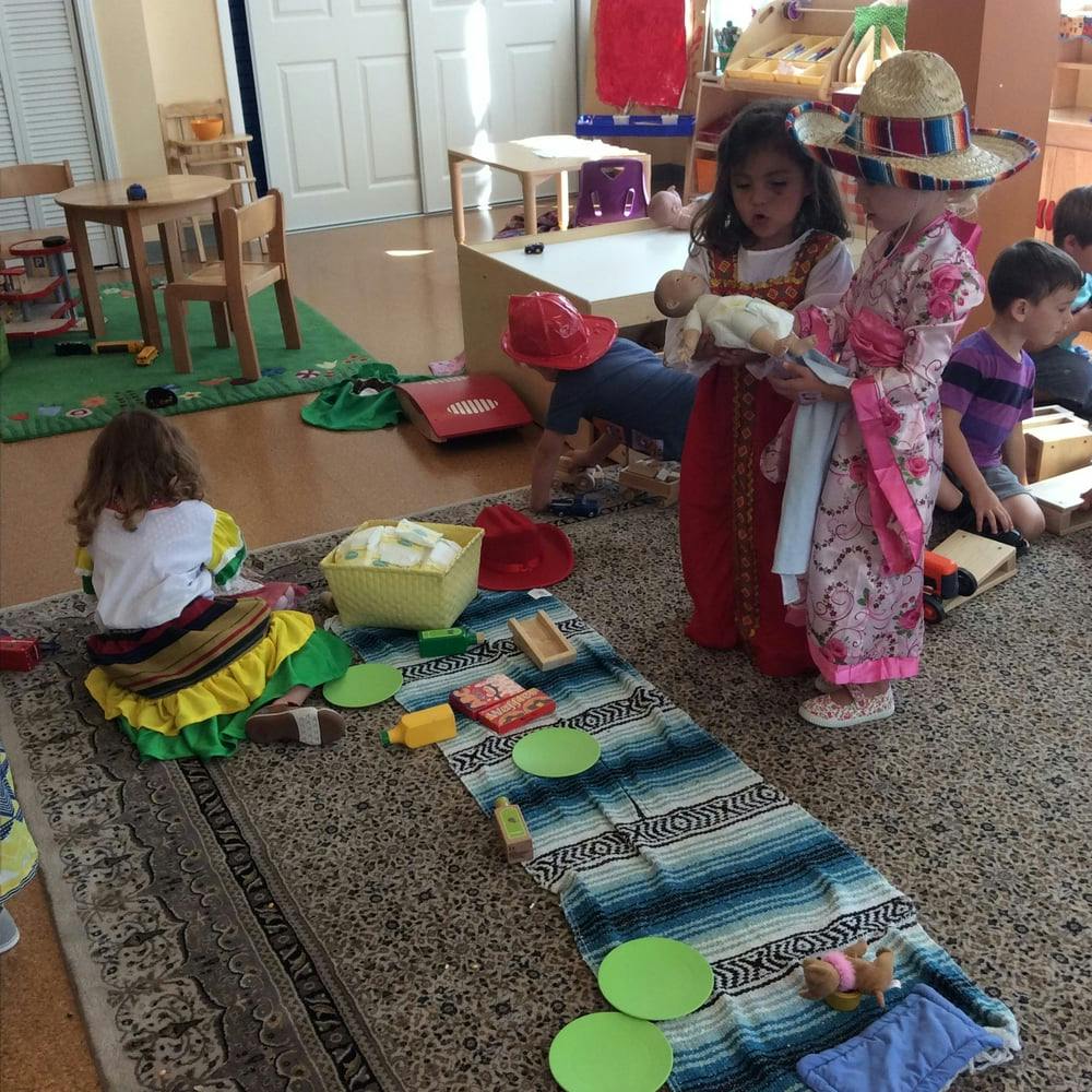 Children playing with toys on a rug
