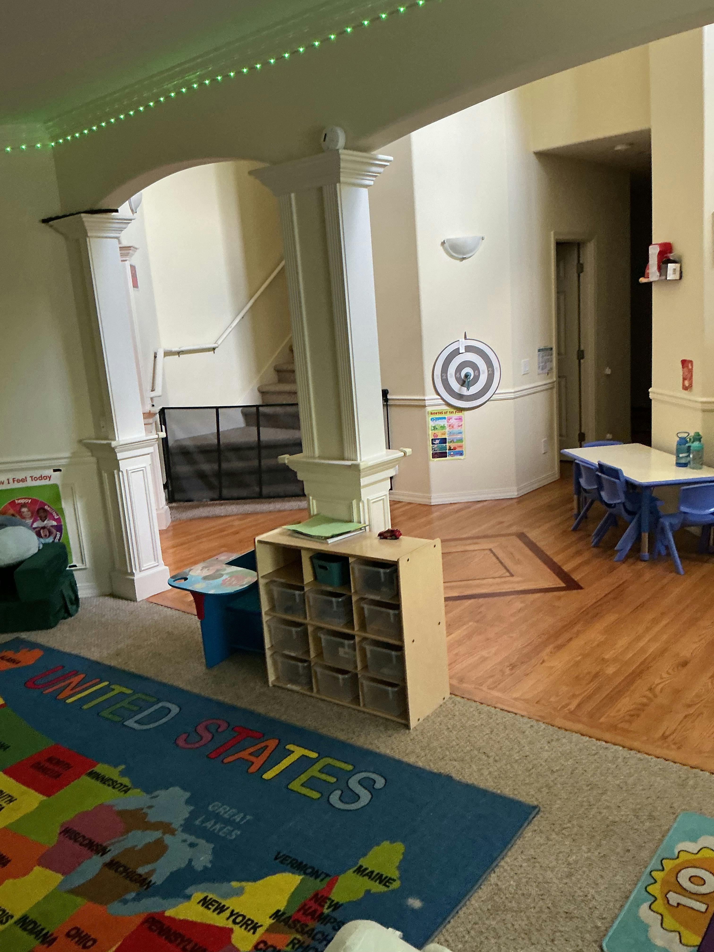 Classroom or play area with United States map rug and storage cubbies