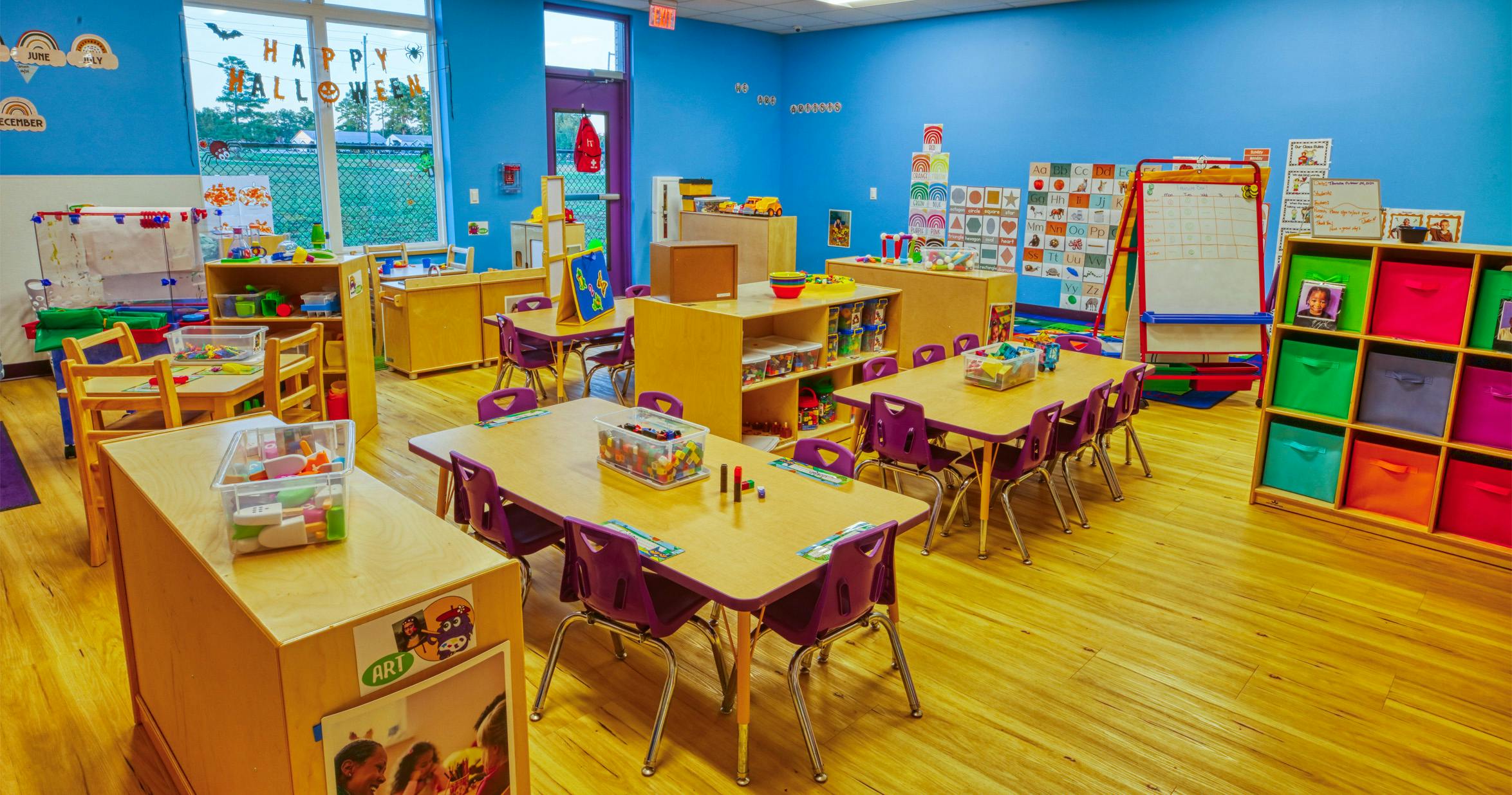 Classroom with small tables, chairs, and learning materials