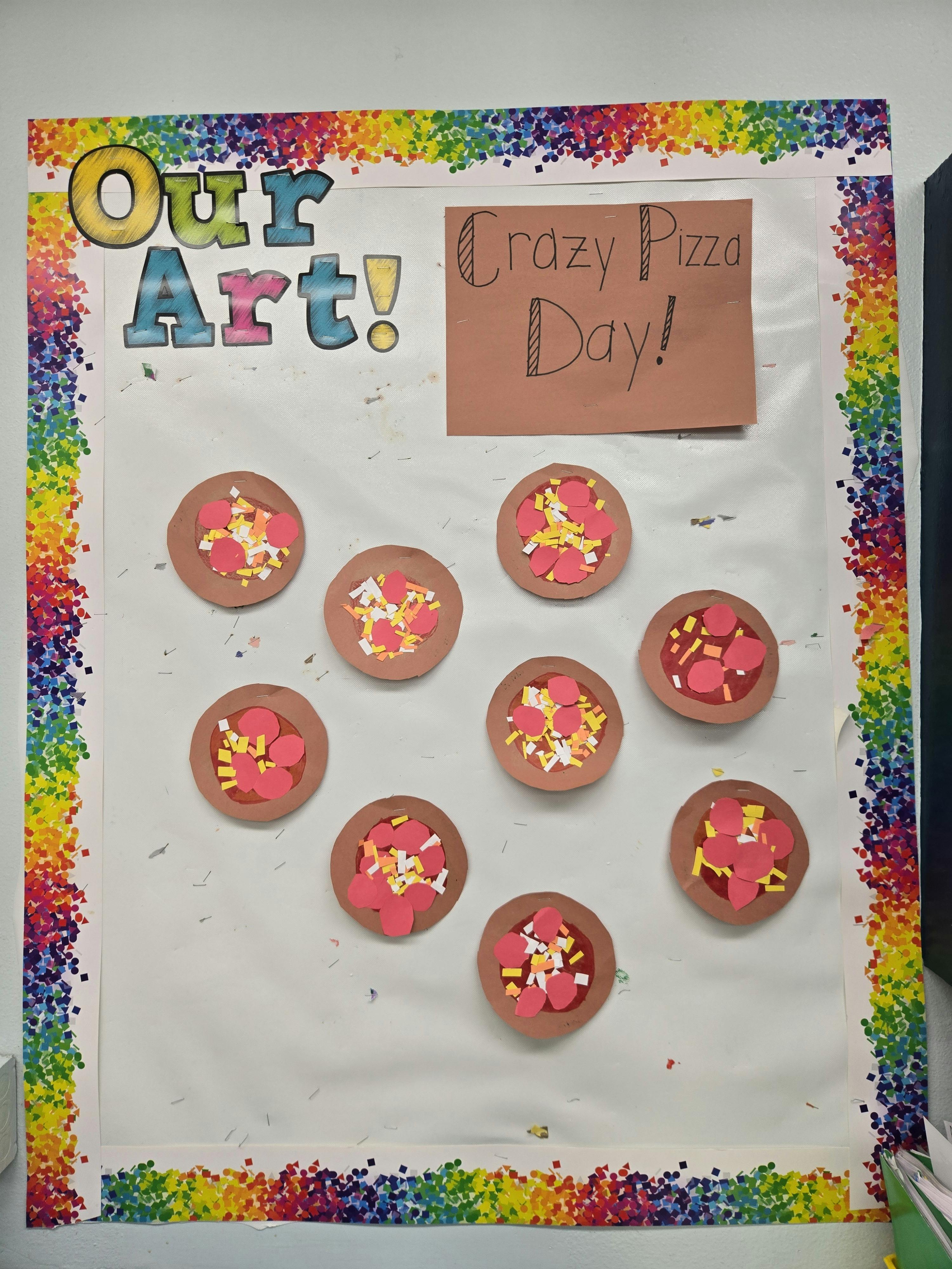 Bulletin board with "Our Art!" and "Crazy Pizza Day!" with pizza crafts
