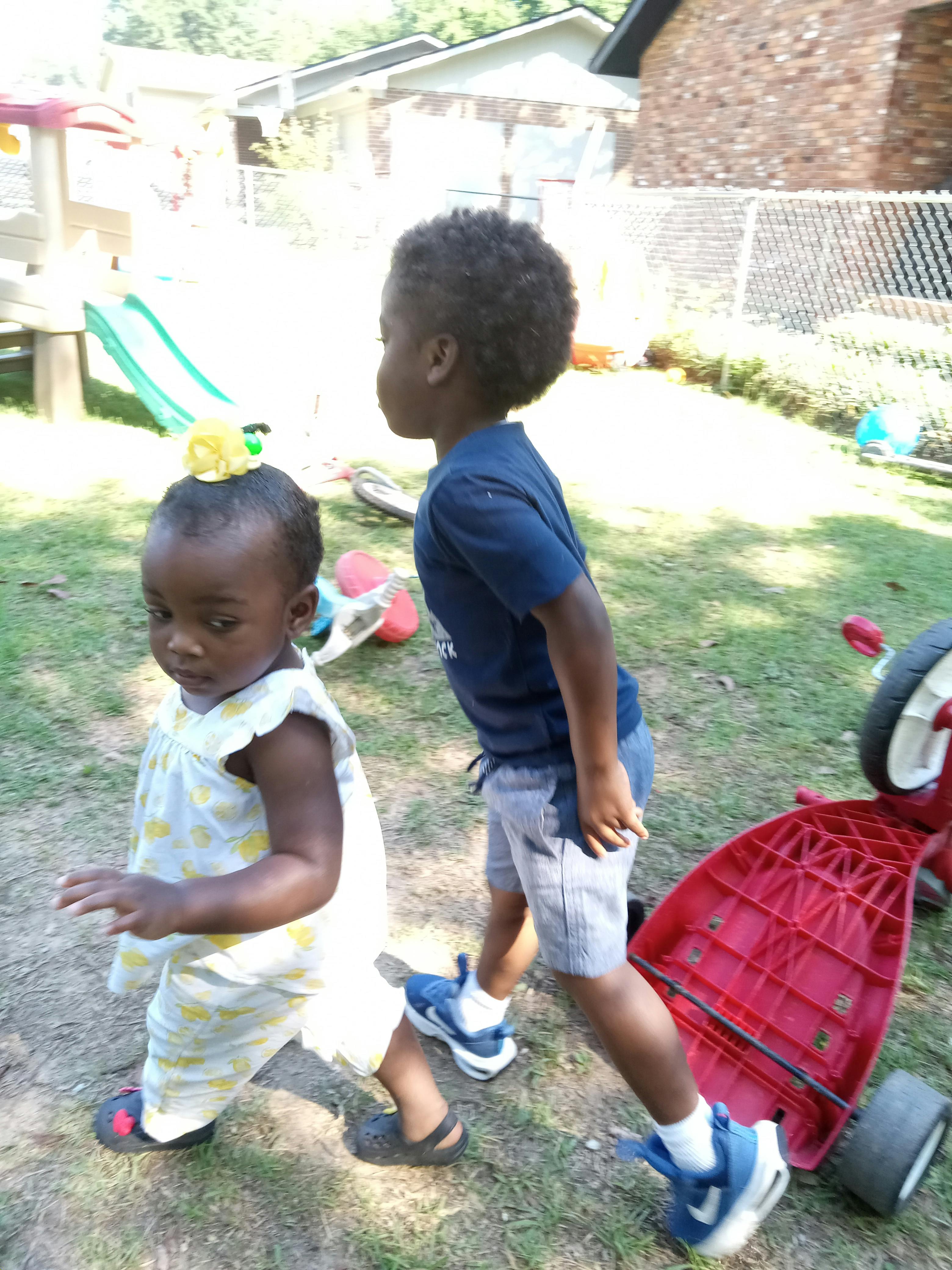 Two children standing outdoors