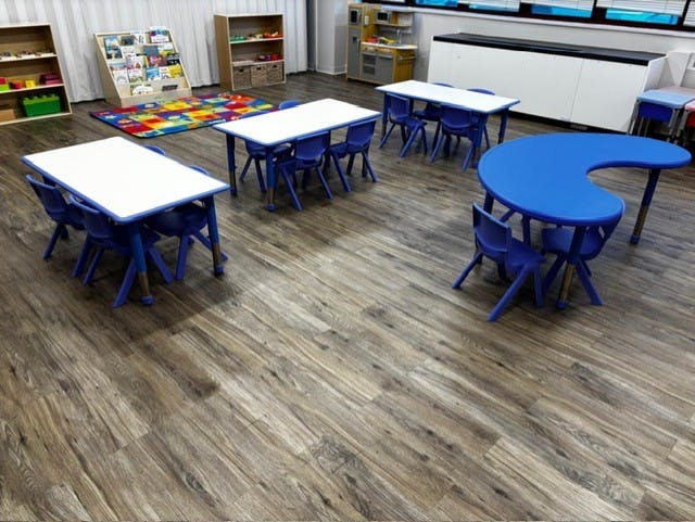 Classroom with blue tables and chairs