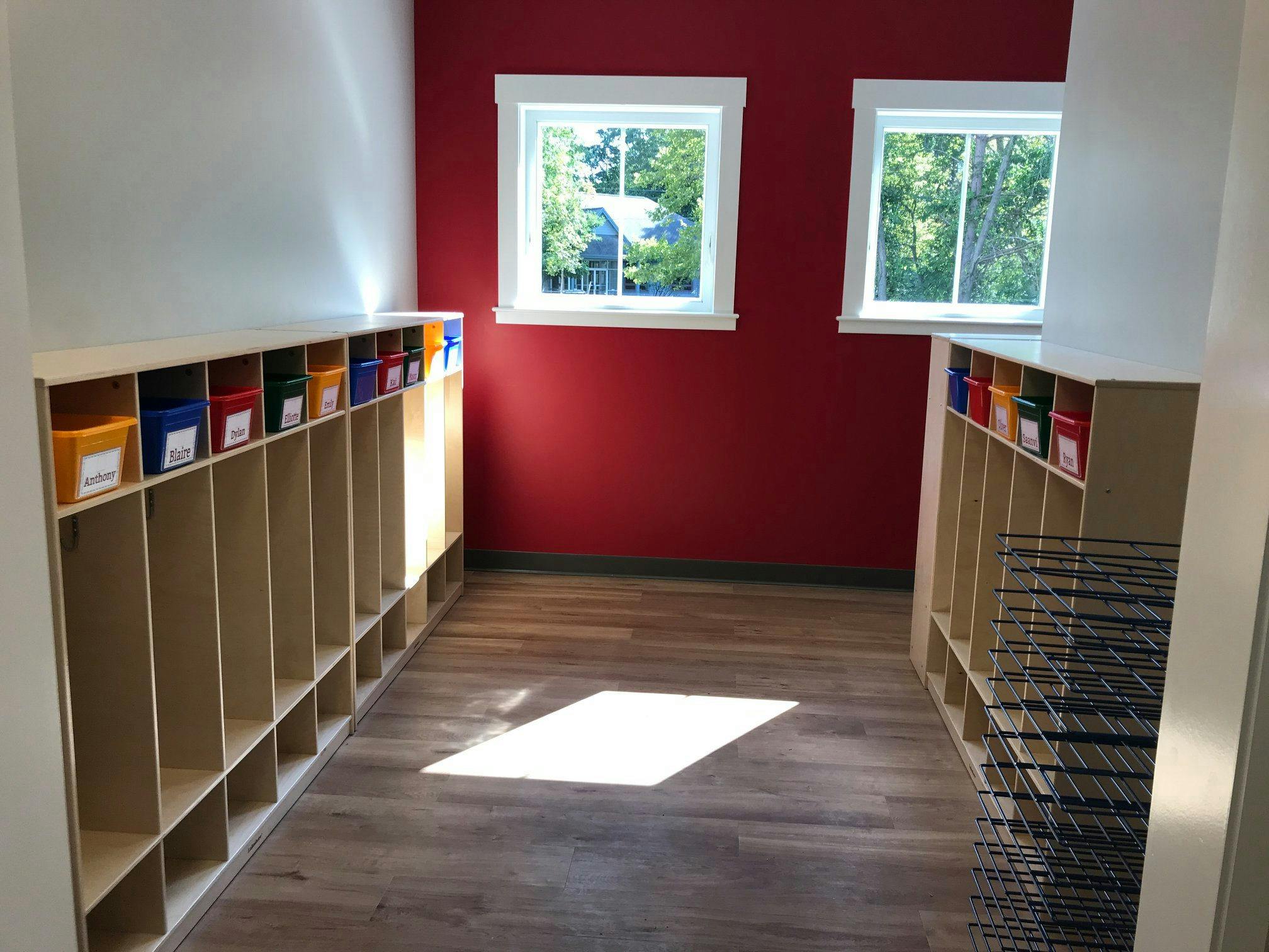 Empty cubbies and drying racks in a classroom