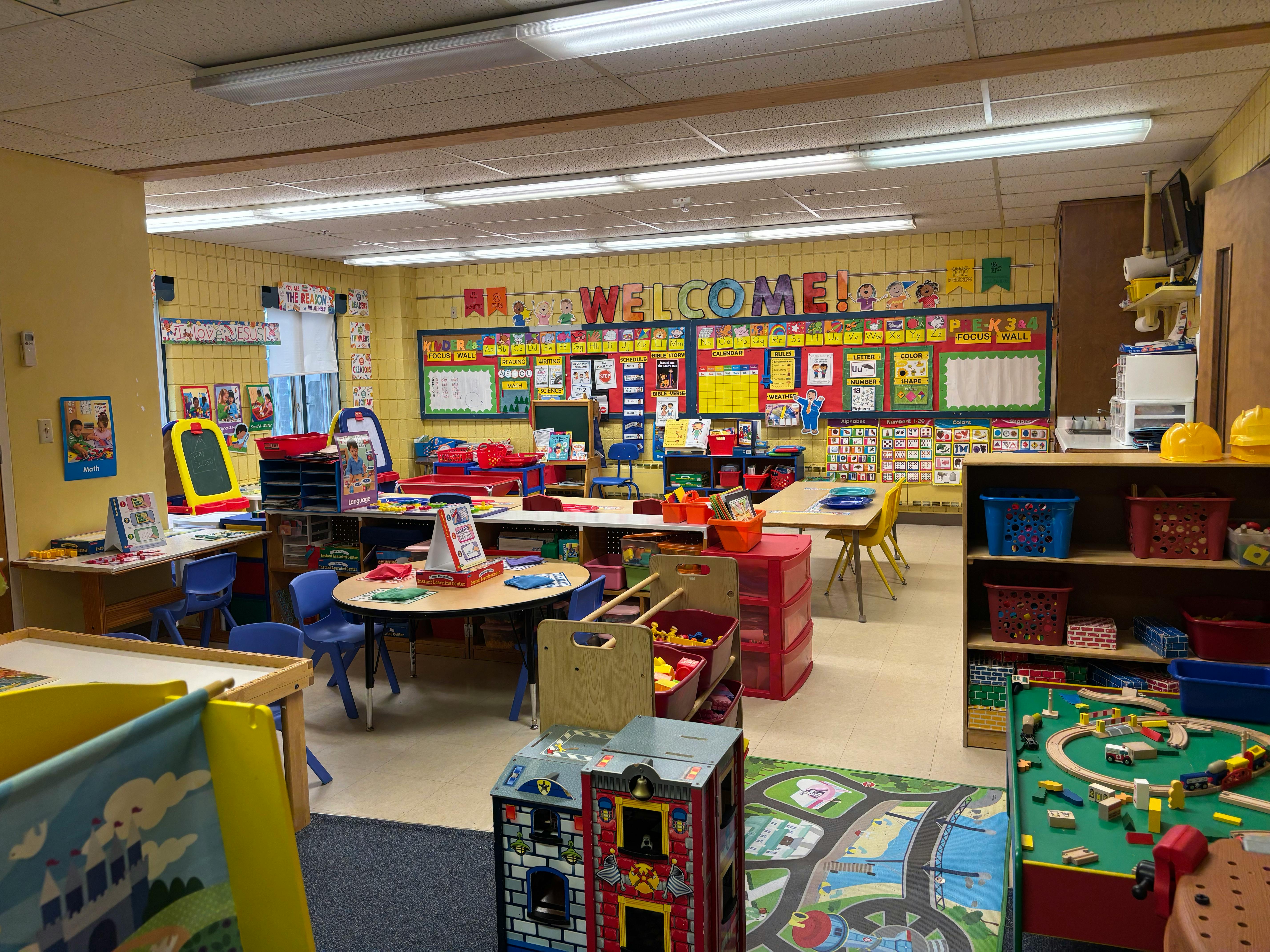 Classroom filled with children's toys and educational wall displays