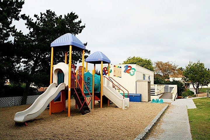Playground with slides and climbing structures on sand