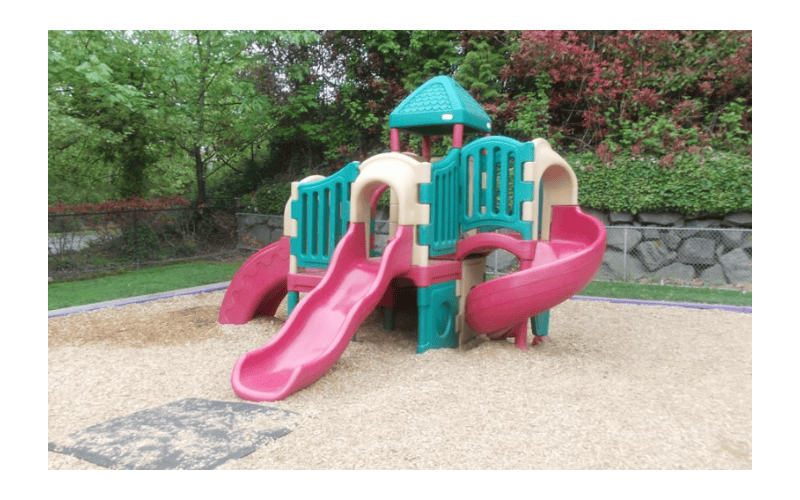 Playground with multiple slides and climbing structures