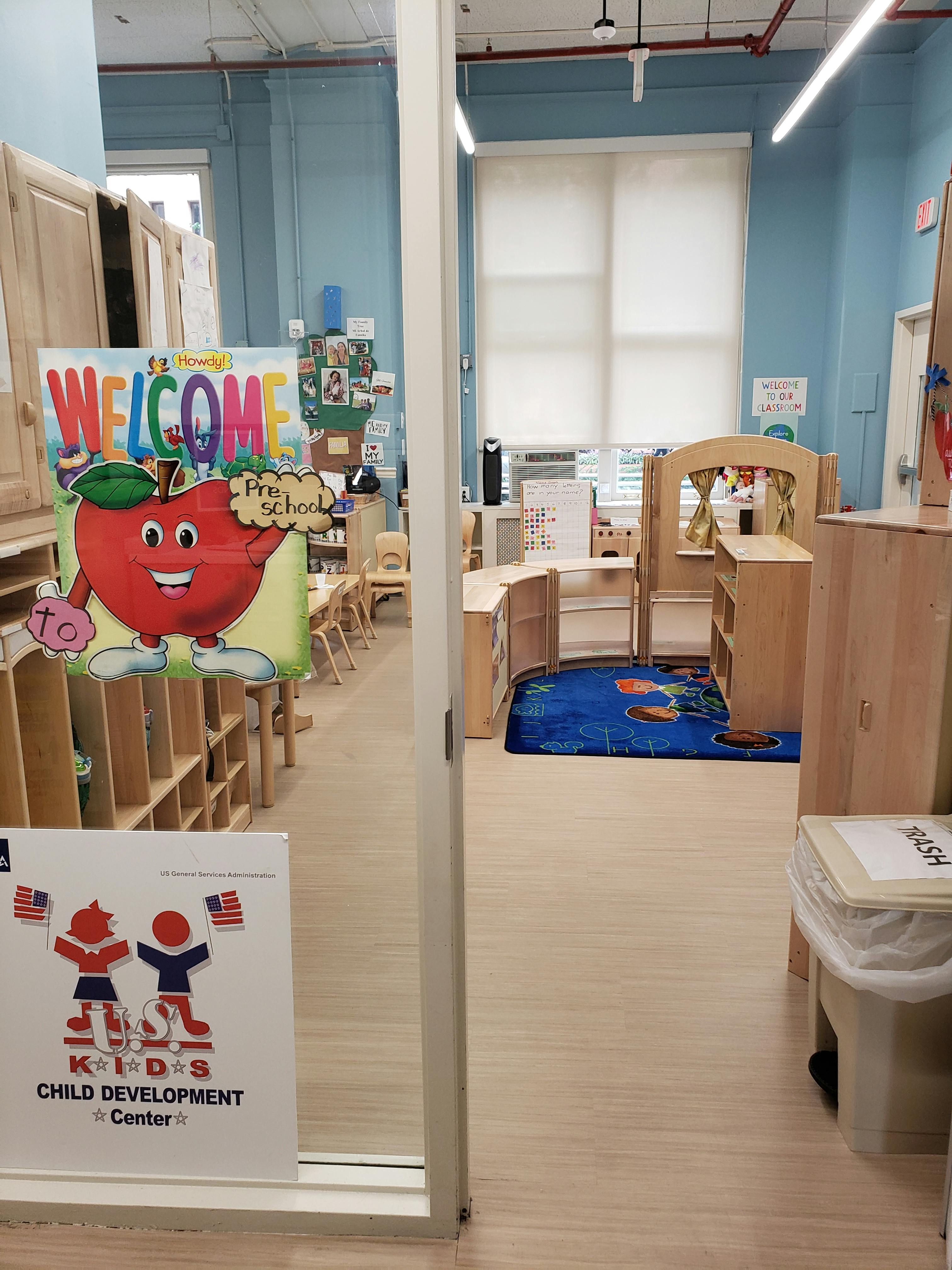 Preschool classroom with a welcome sign and play area