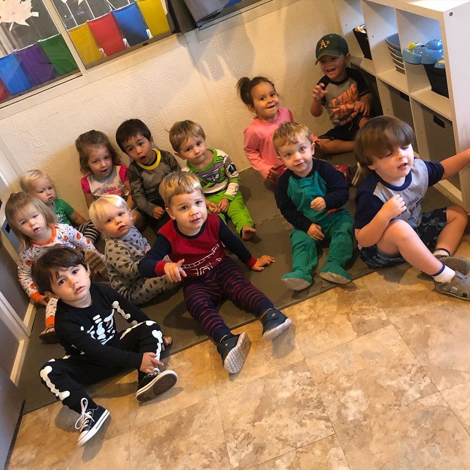 Group of children sitting on the floor