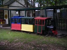Colorful miniature train on tracks