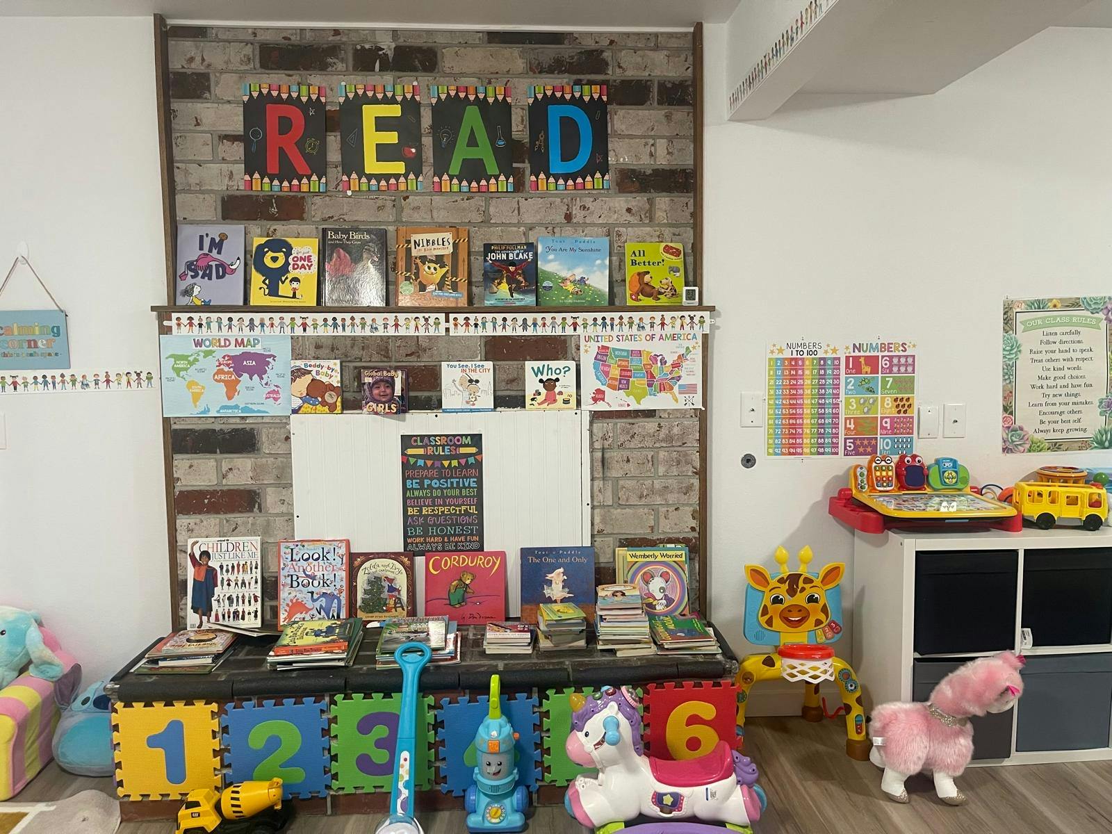 Children's classroom with \"READ\" sign, books, and educational toys