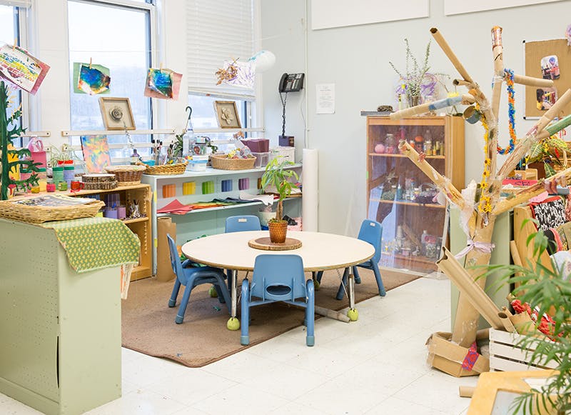 Classroom with small round table and blue chairs