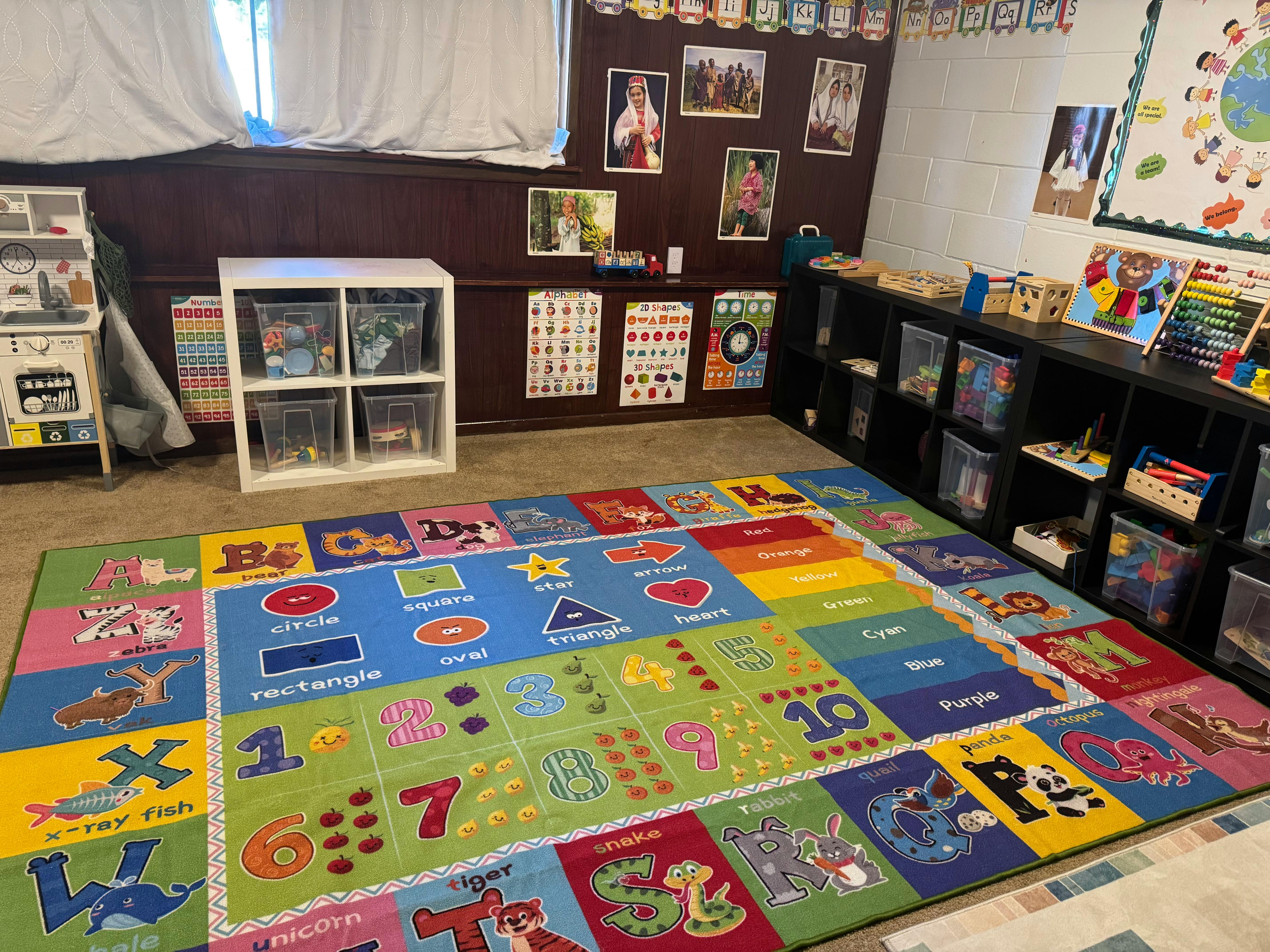 Colorful alphabet and number rug in a classroom