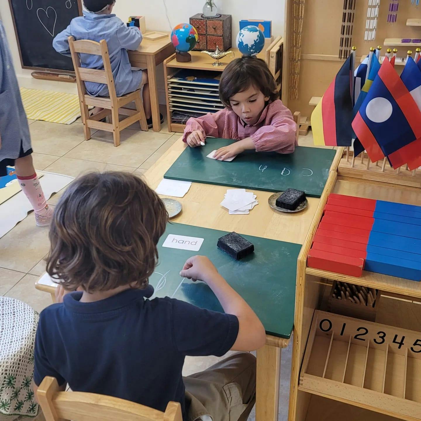 Children working at desks in a classroom