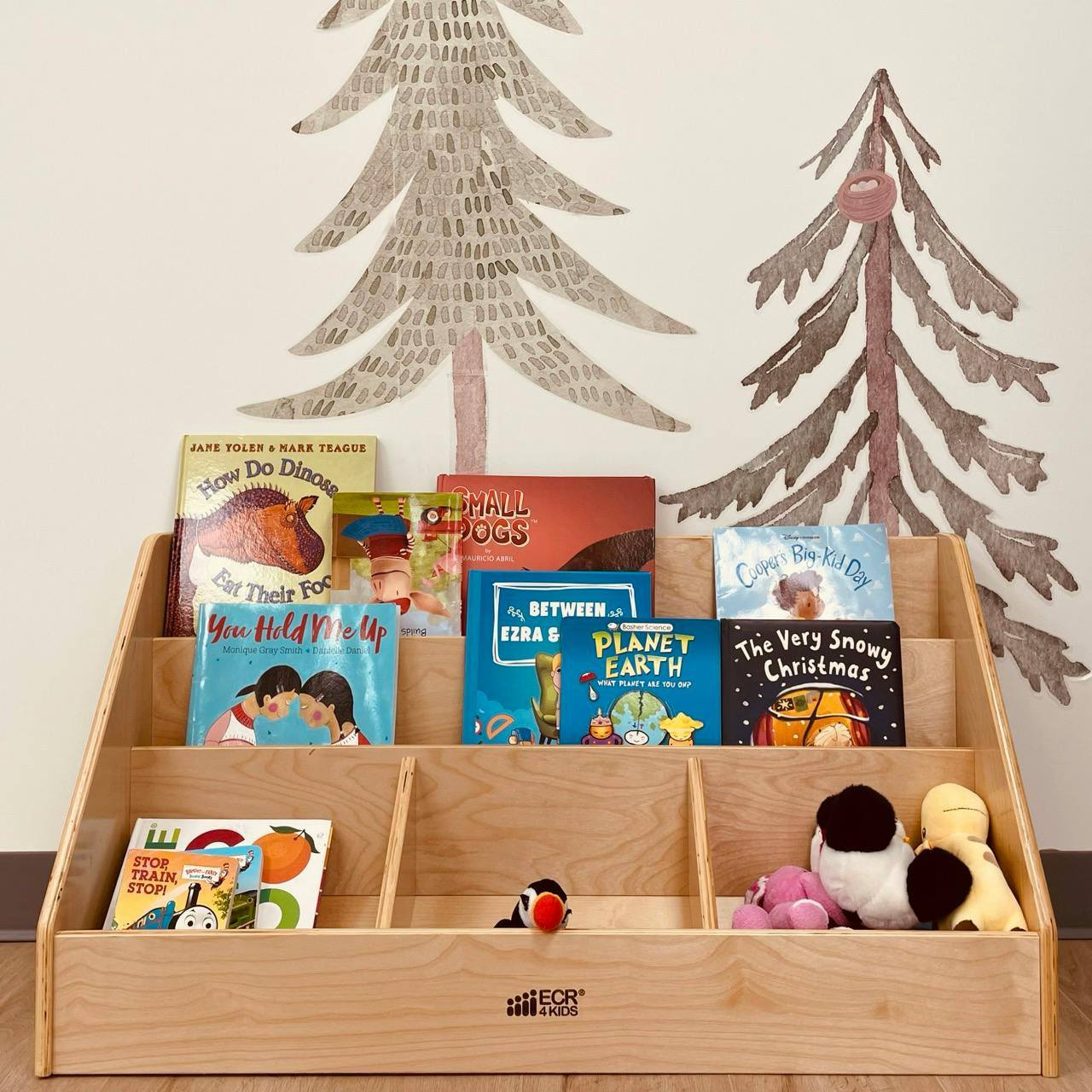 Wooden bookshelf with children's books and stuffed animals