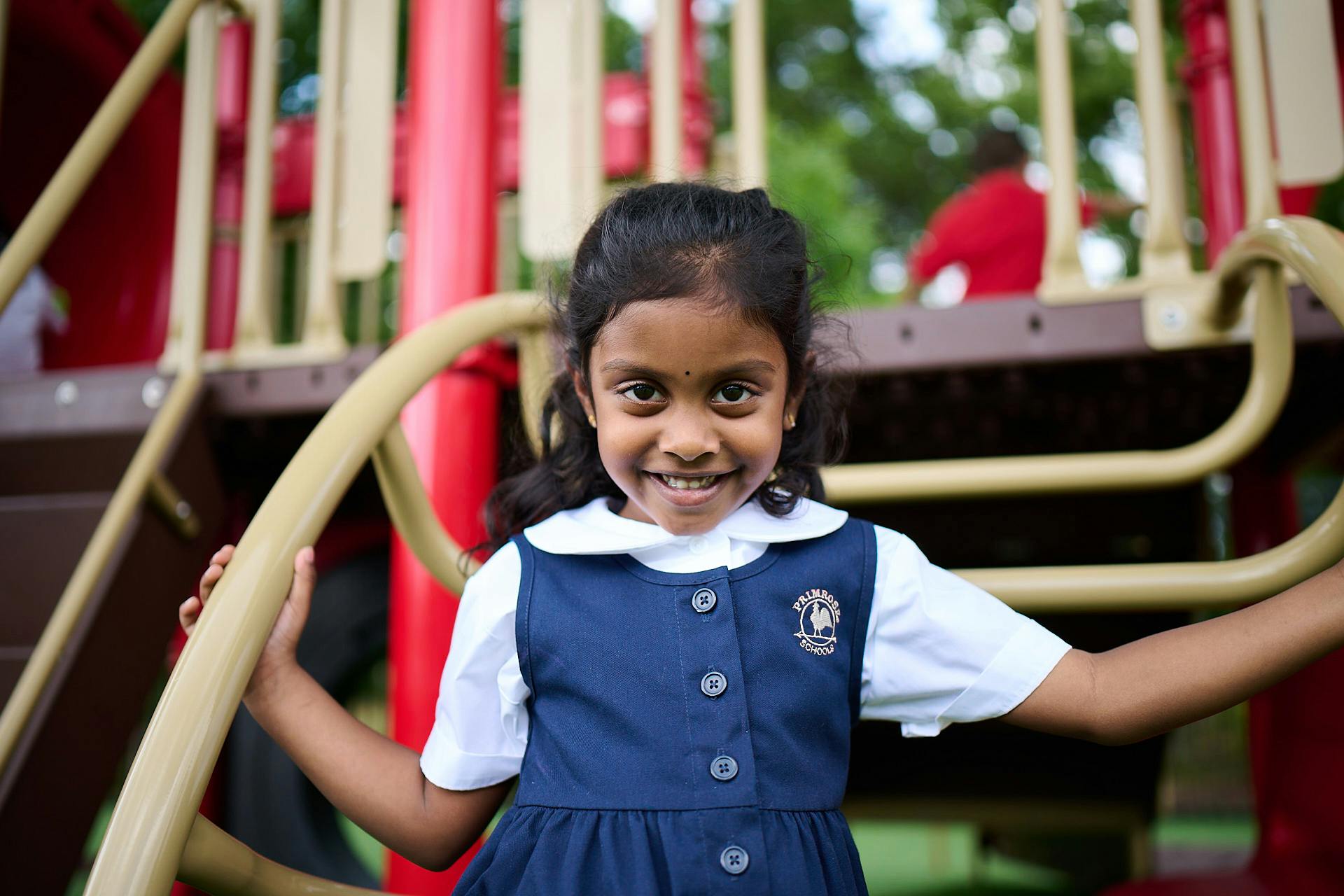 Child in uniform on a playground