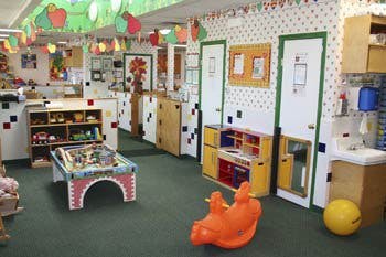 Playroom with toys, small furniture, and decorations