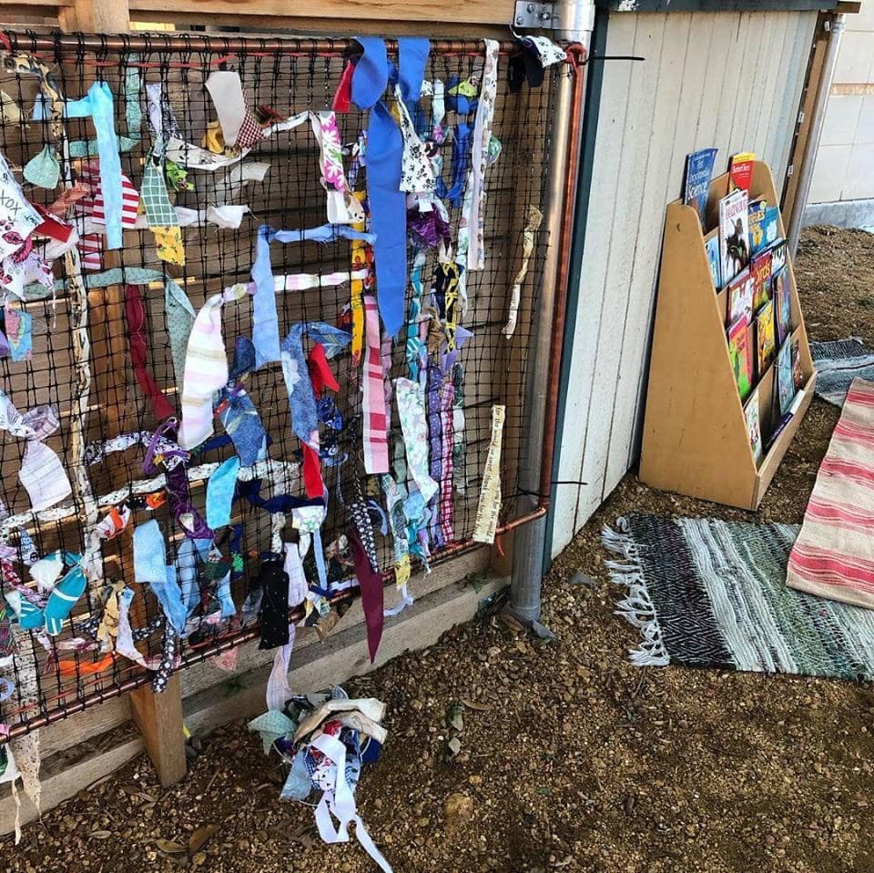 Fabric strips tied to a wire fence