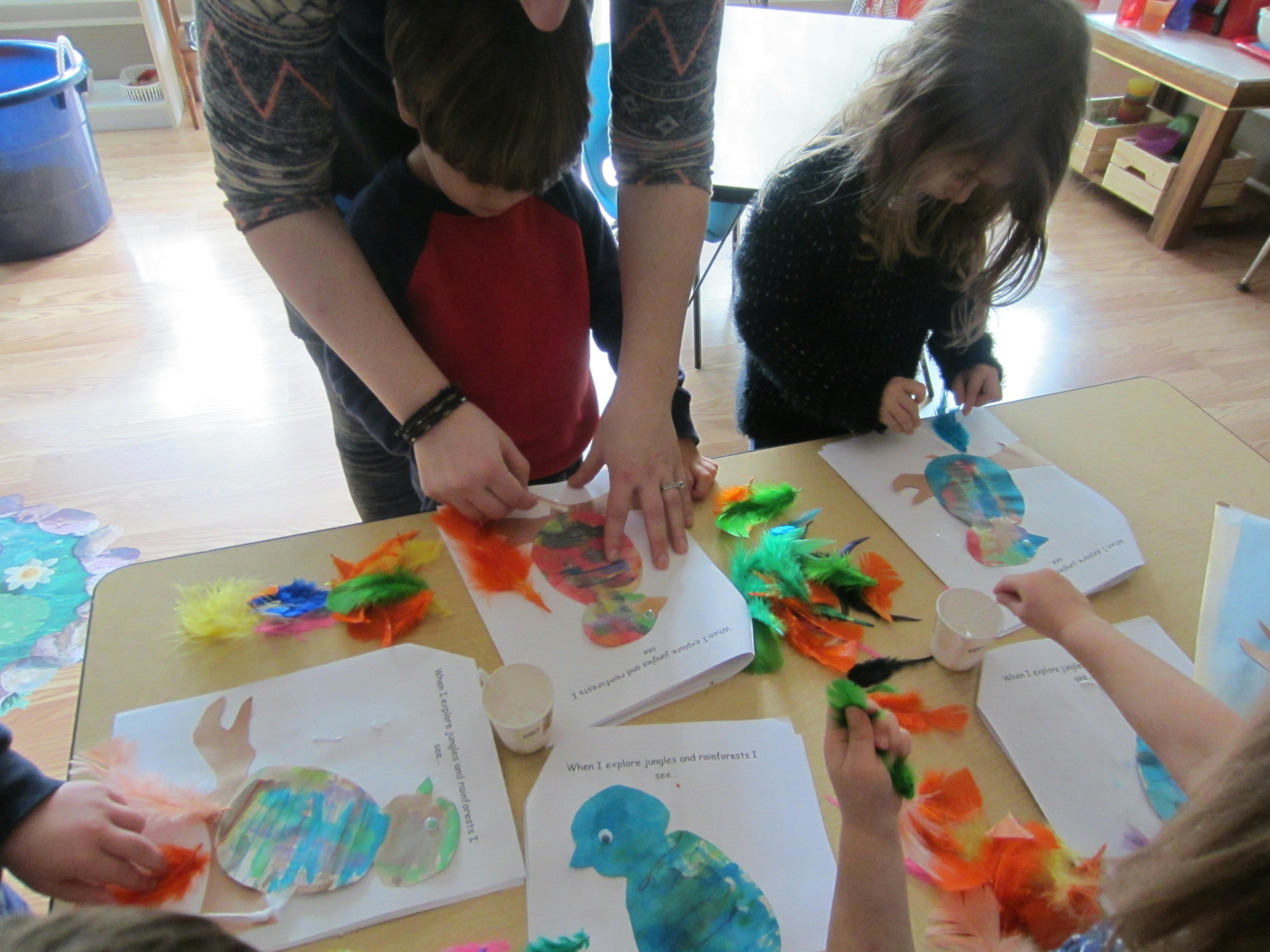 Adult and children doing crafts at a table