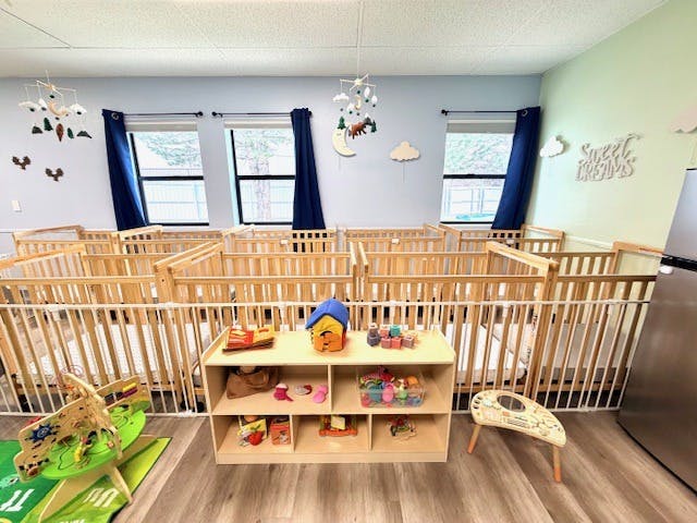 cribs in a daycare room