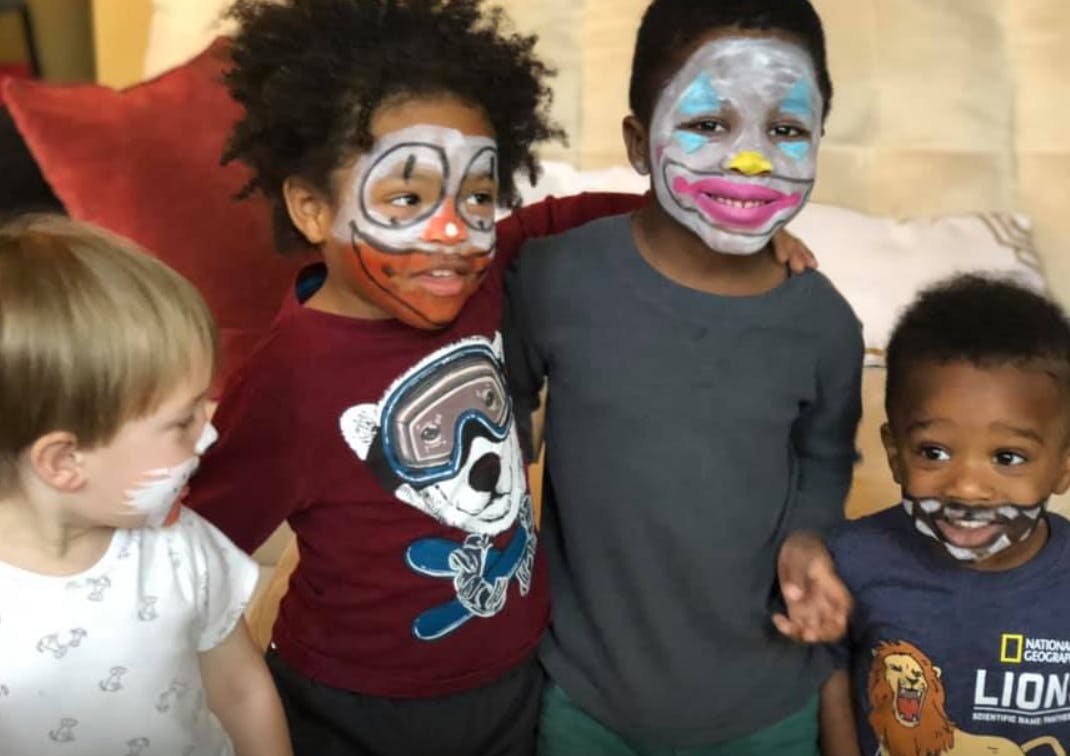 Four children with face paint