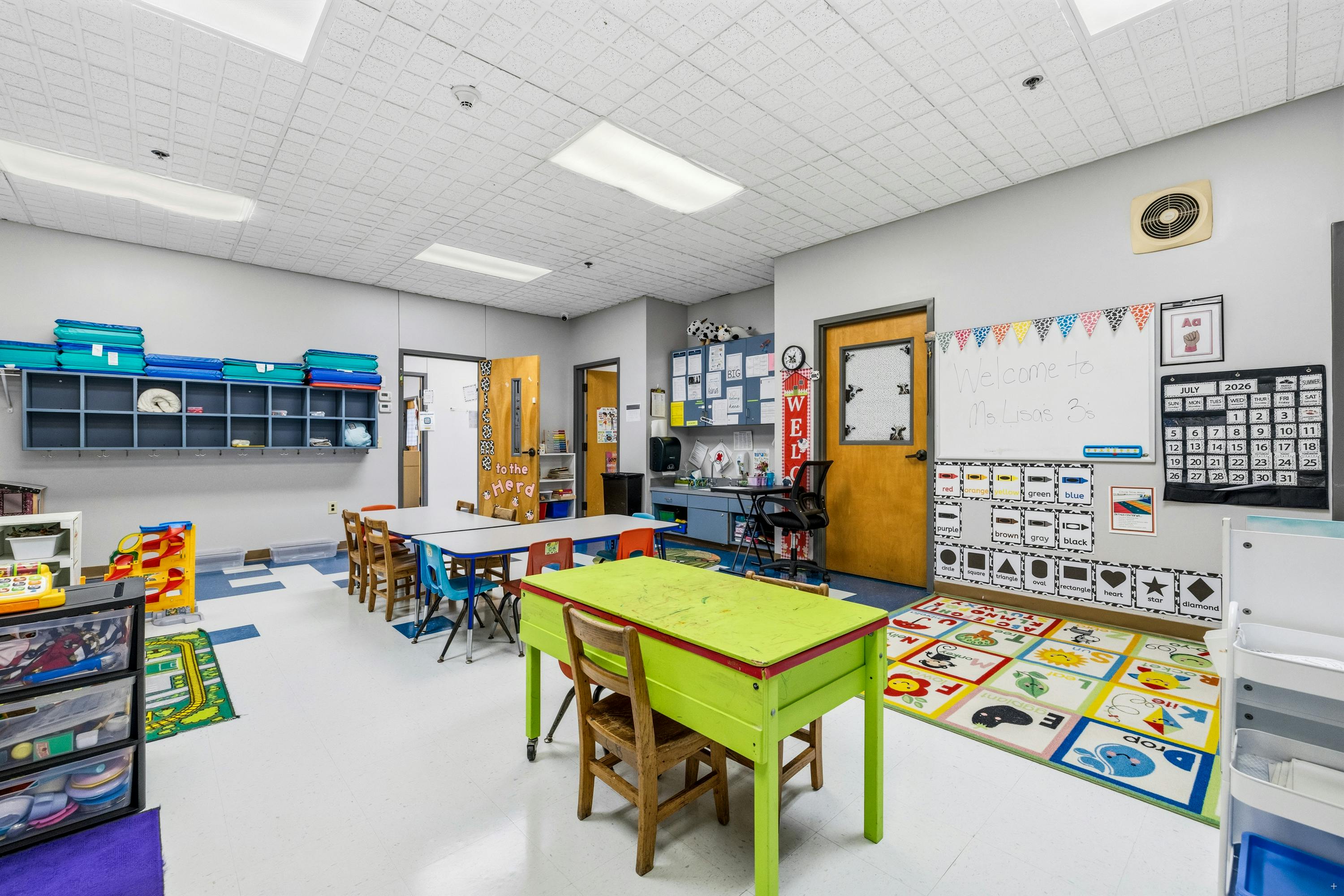 Classroom interior with small tables and chairs for children