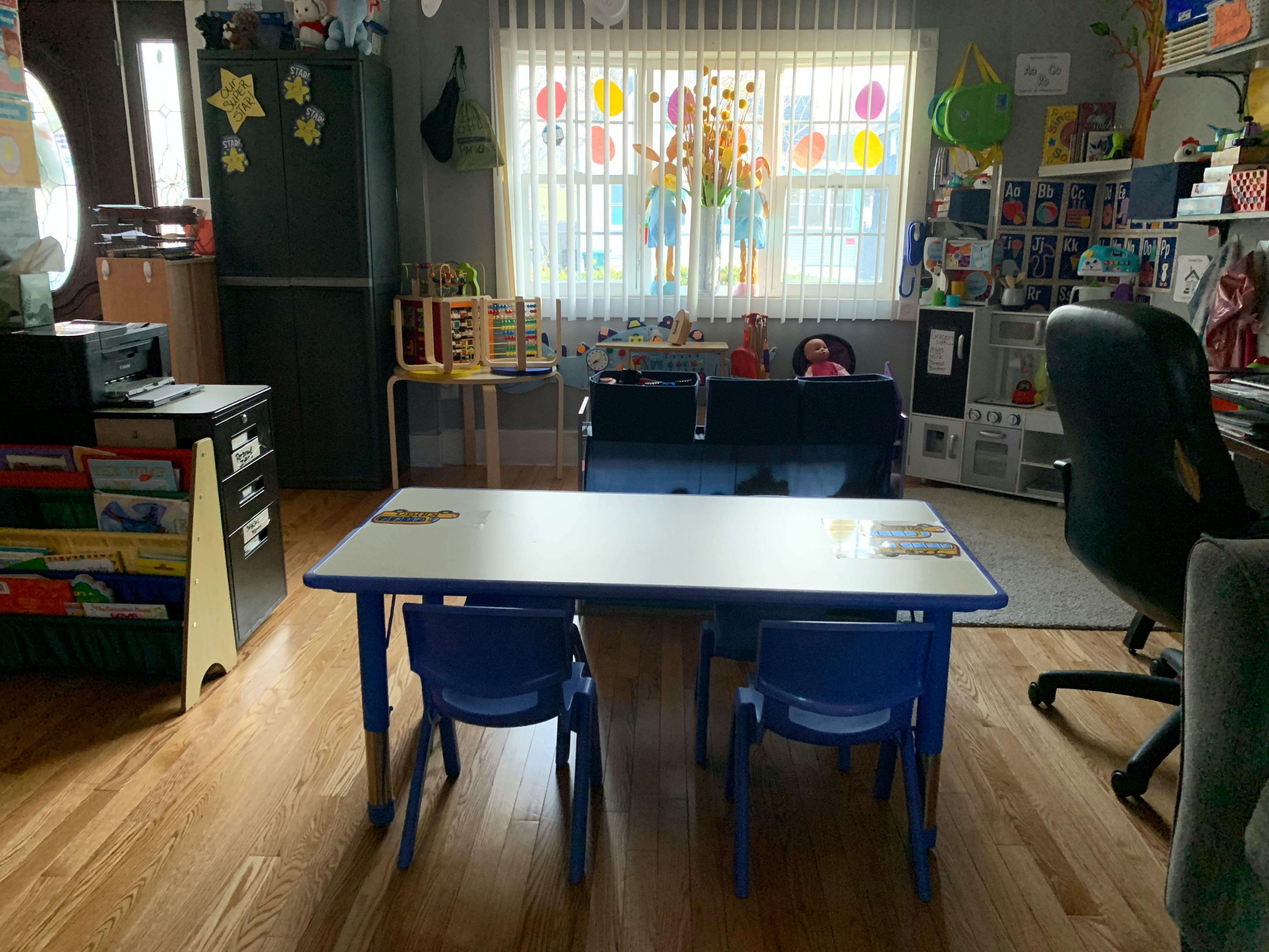 Classroom with a table and chairs in the foreground