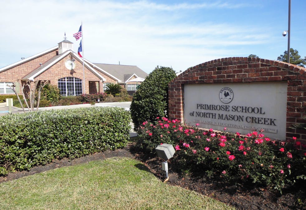 Primrose School of North Mason Creek sign with building in background