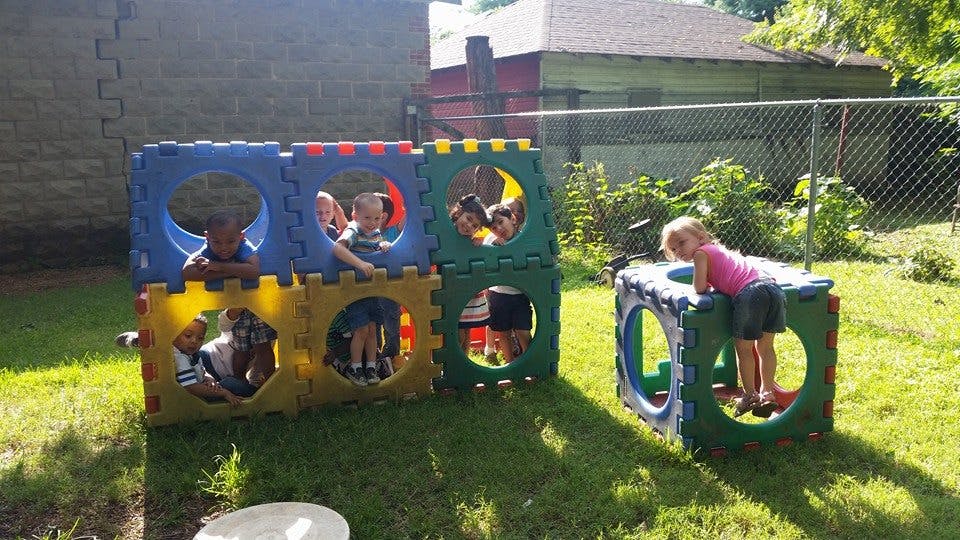 Children playing on outdoor climbing structures