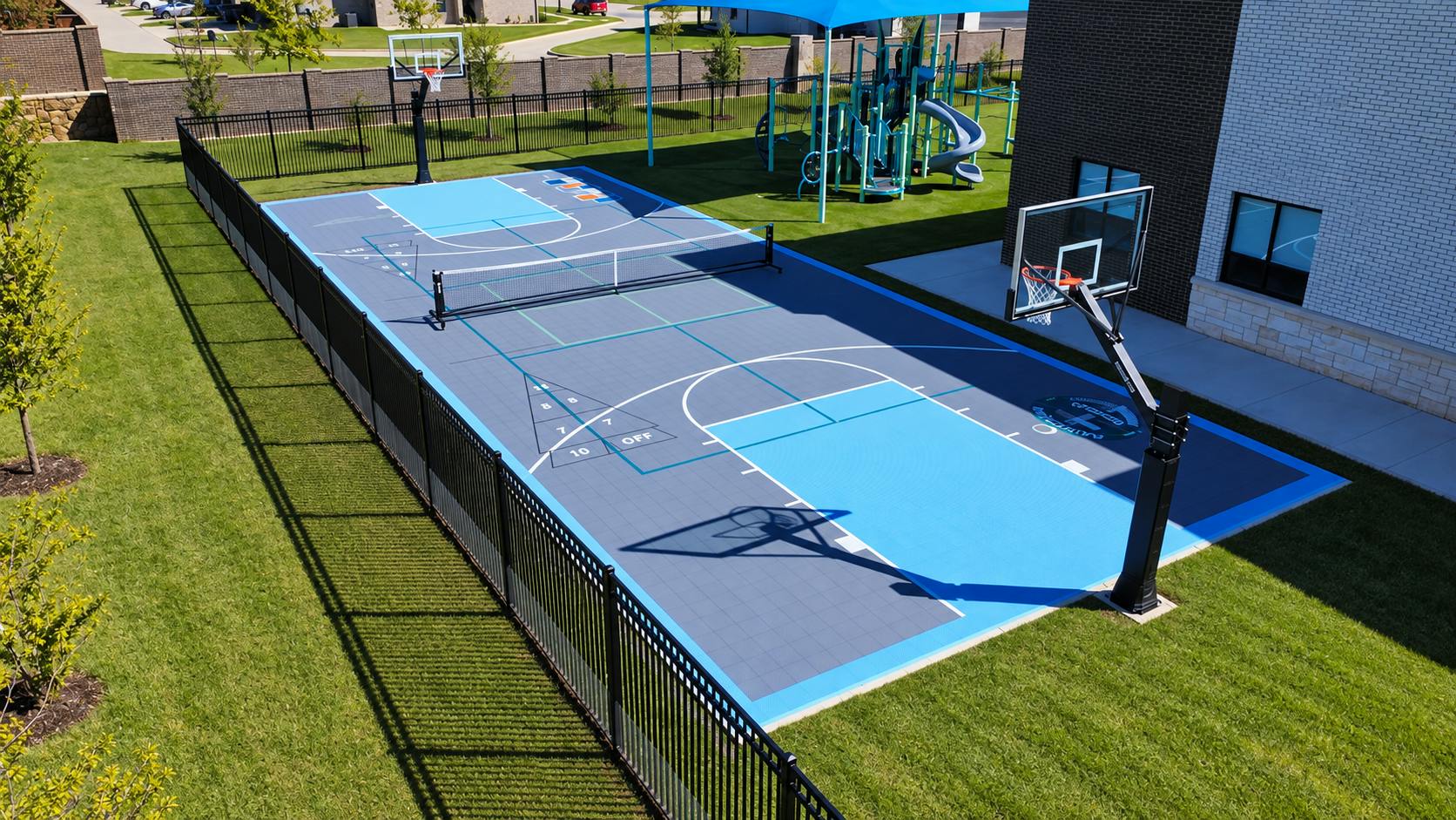 Multipurpose sports court with basketball hoops and a tennis net