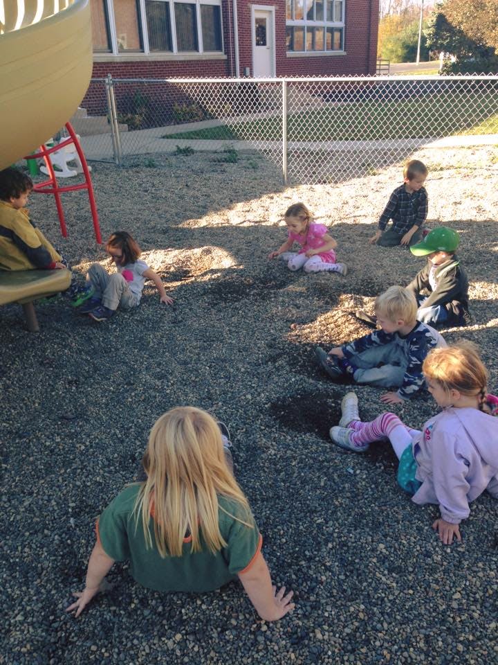 Children playing in a gravel playground