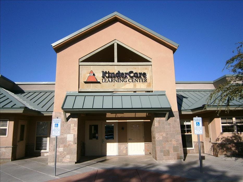 KinderCare Learning Center building entrance with blue sky