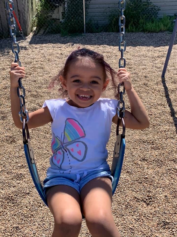 Child on a swing at a playground