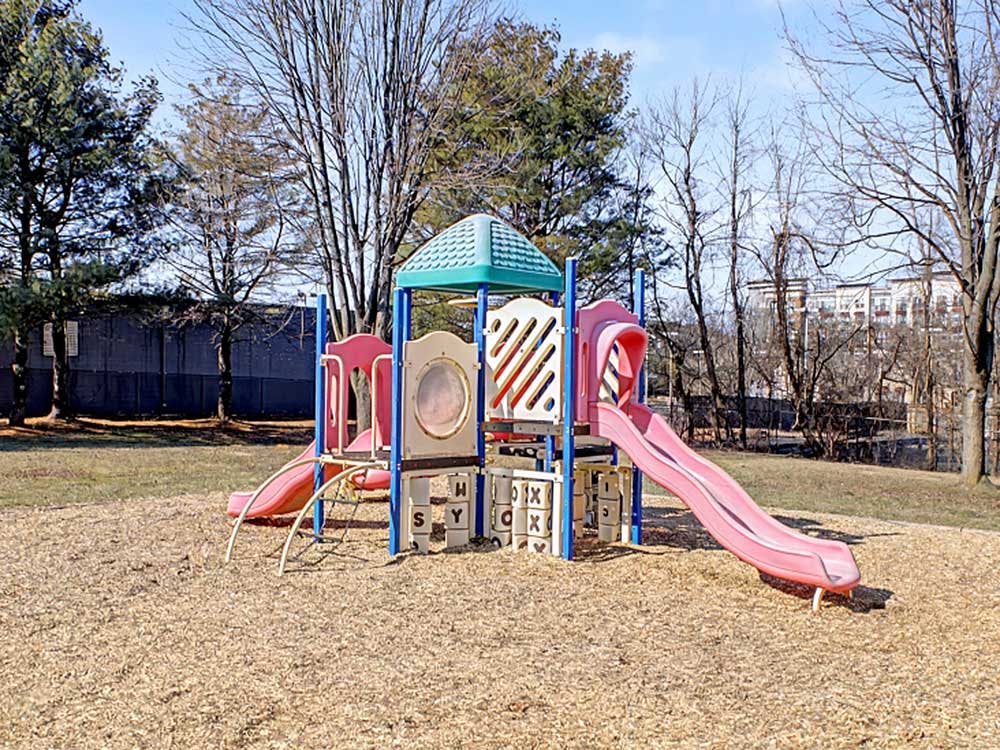 A colorful playground with slides and climbing structures