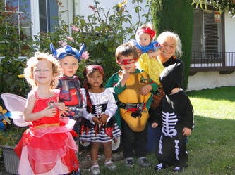 Adult and multiple children in costumes
