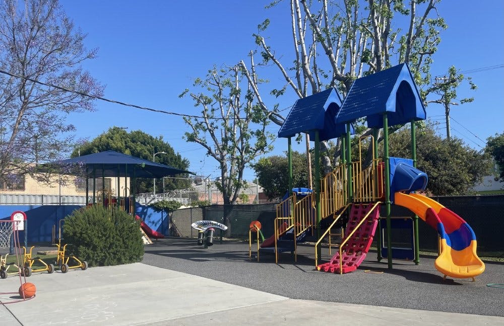 Colorful playground with multiple slides and climbing structures