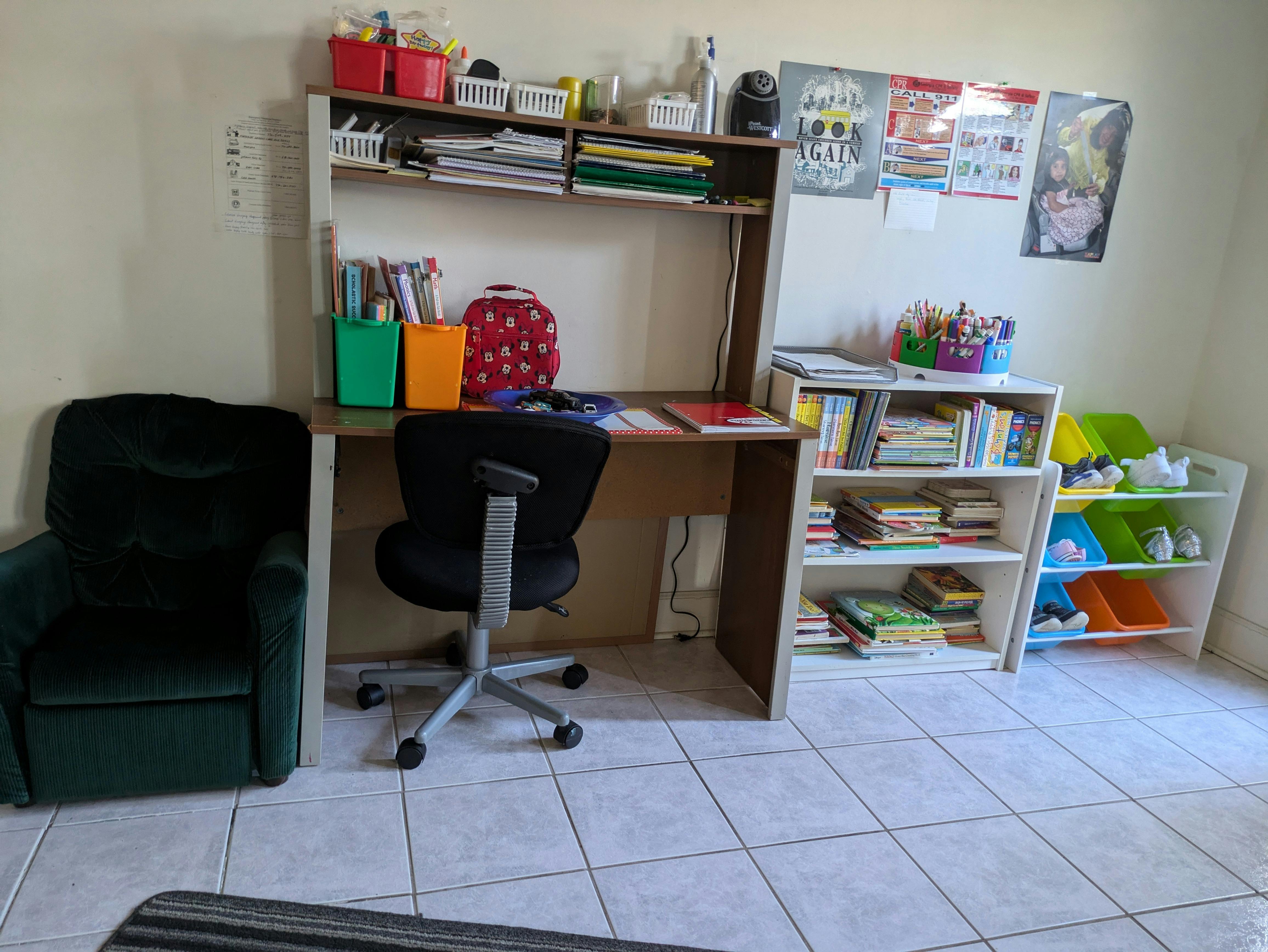 Study desk with chair and bookshelves in a room