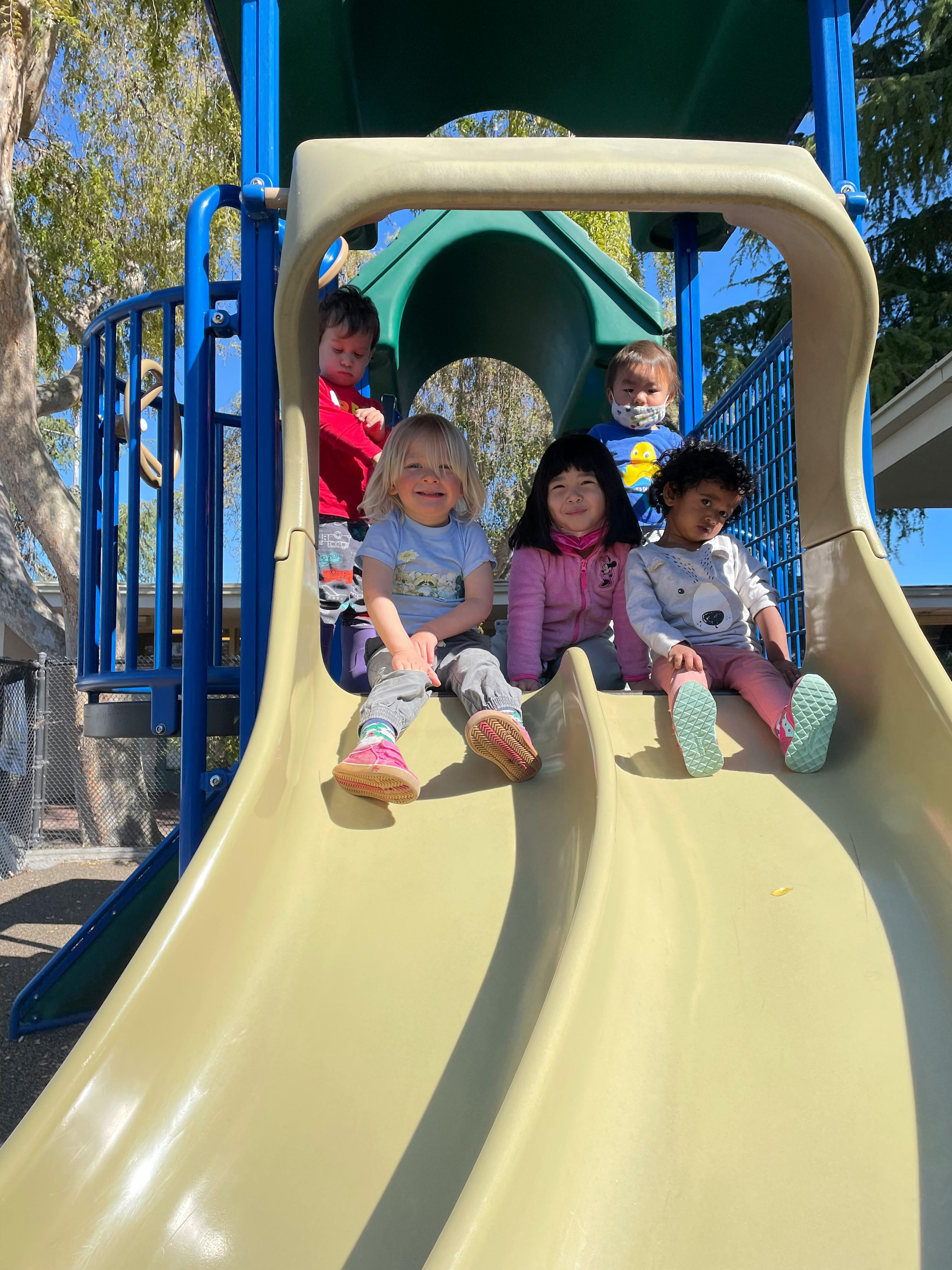 Children on a playground slide