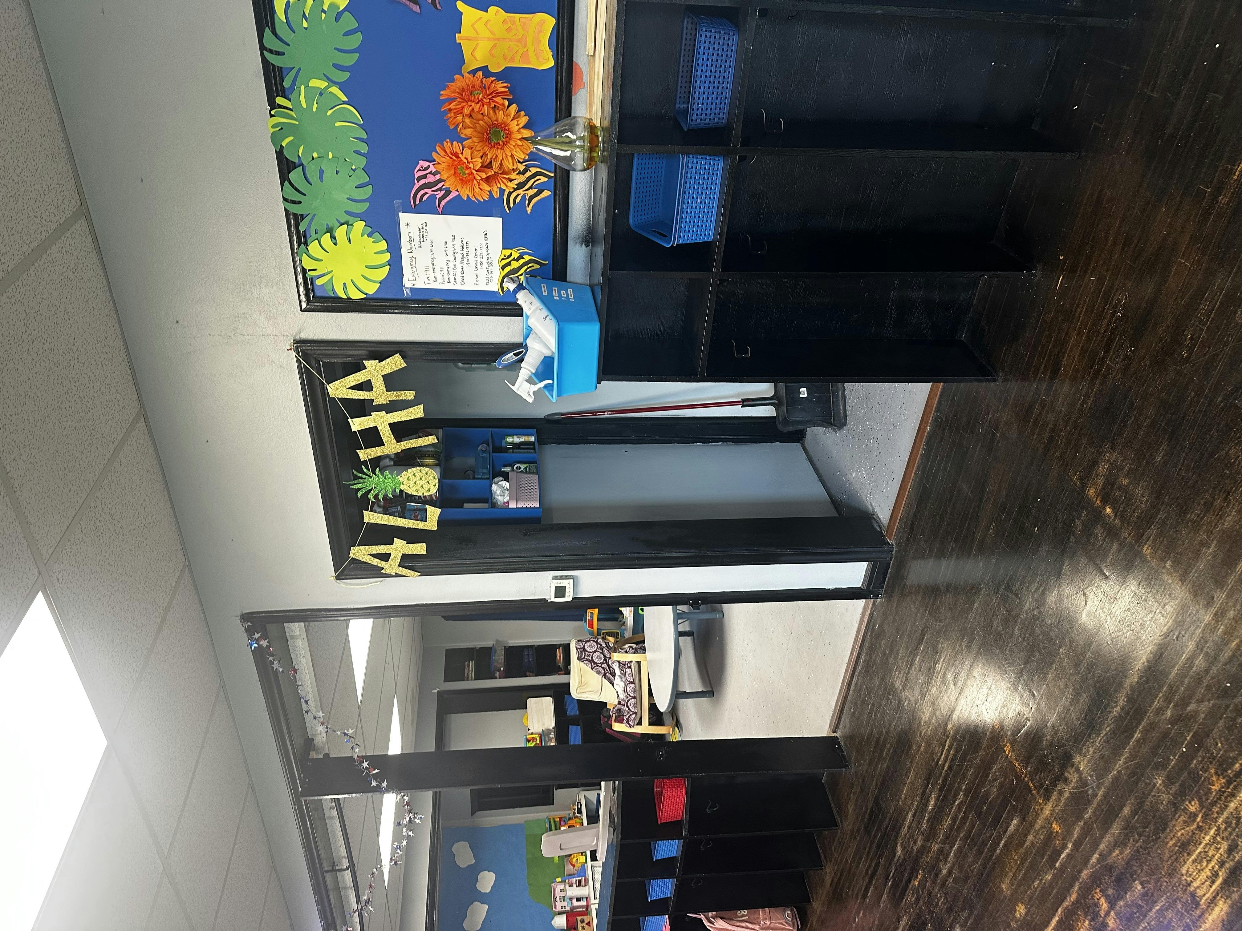 Classroom doorway with "ALOHA" banner and bulletin board